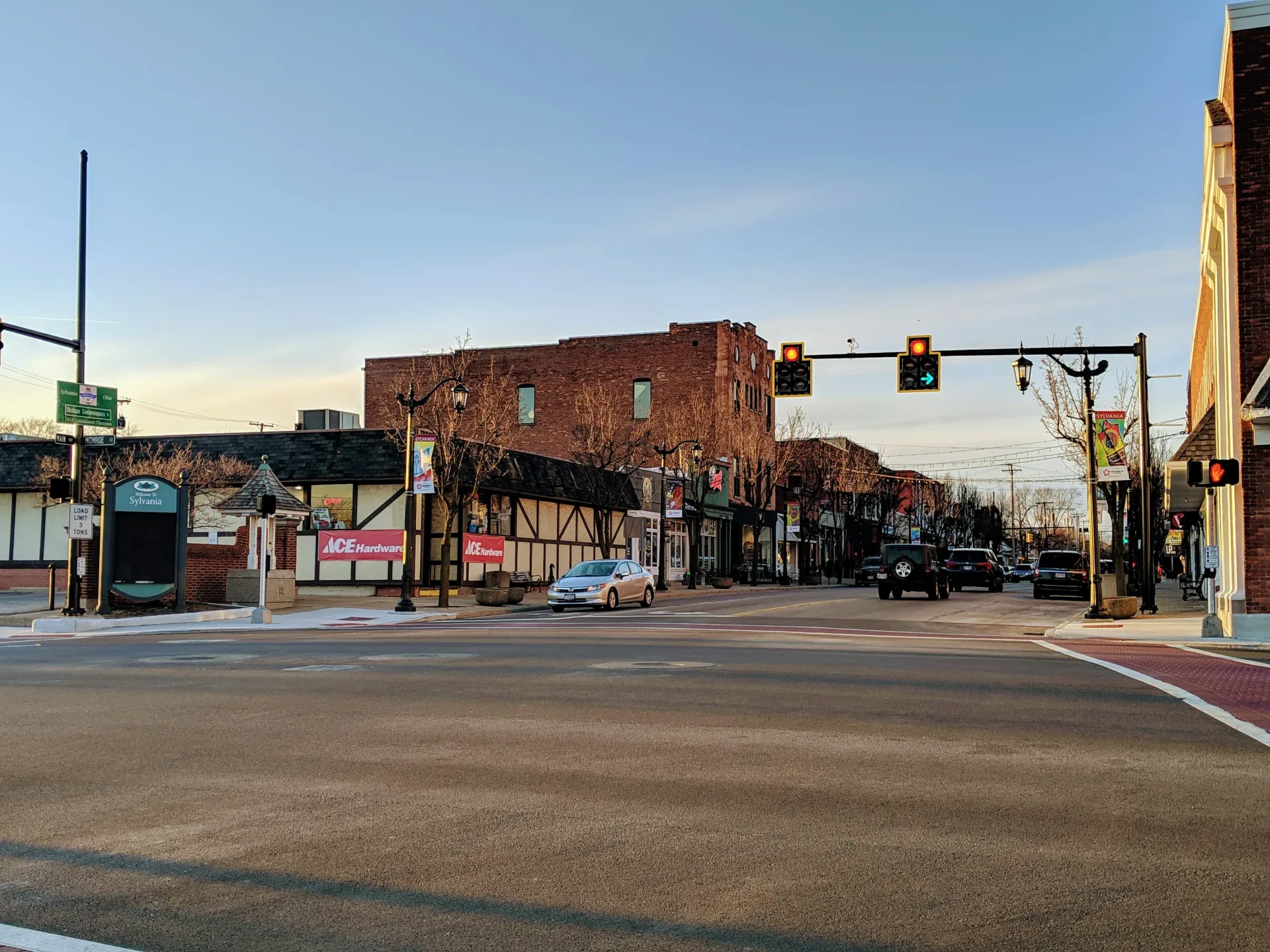 Downtown Sylvania, Ohio at golden hour, with historic storefronts along Main Street